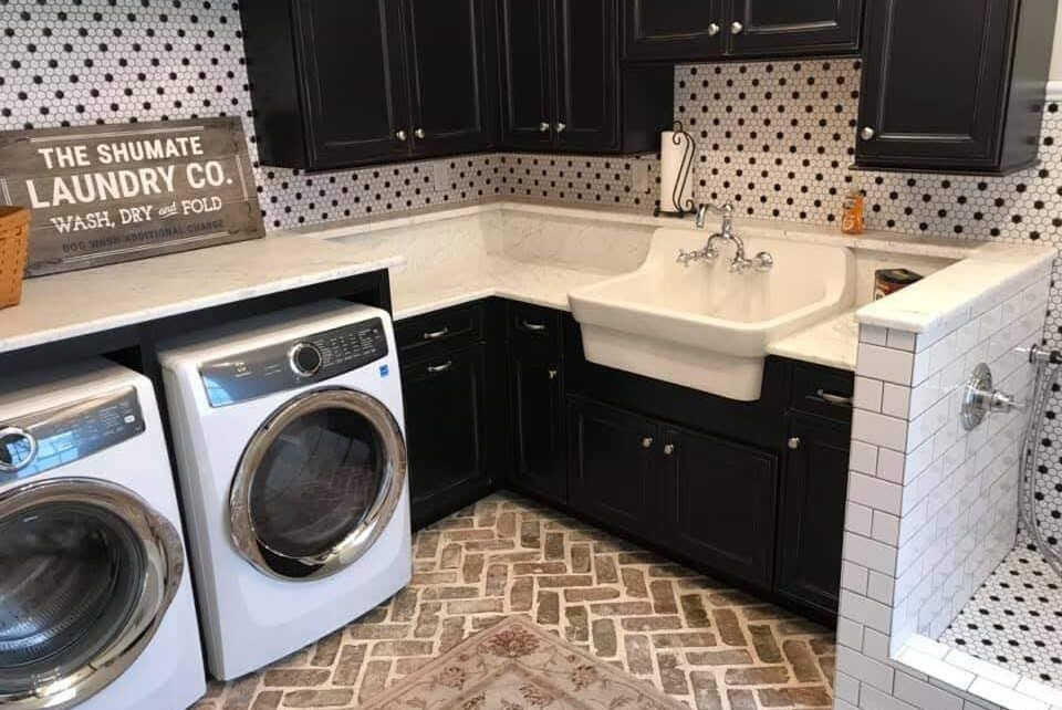 Laundry room with marble finishing