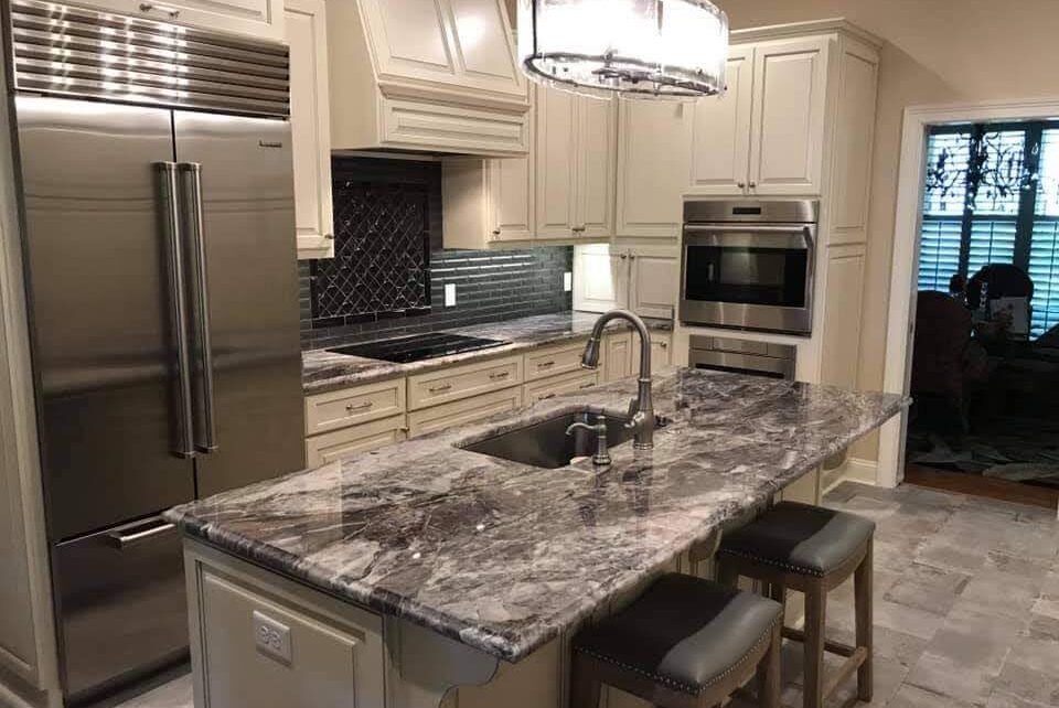 Full kitchen with marble finishing